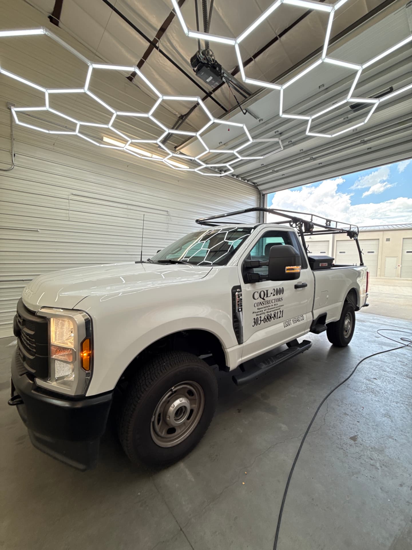 White Ford Super Duty commercial work truck with ceramic tint in the install bay