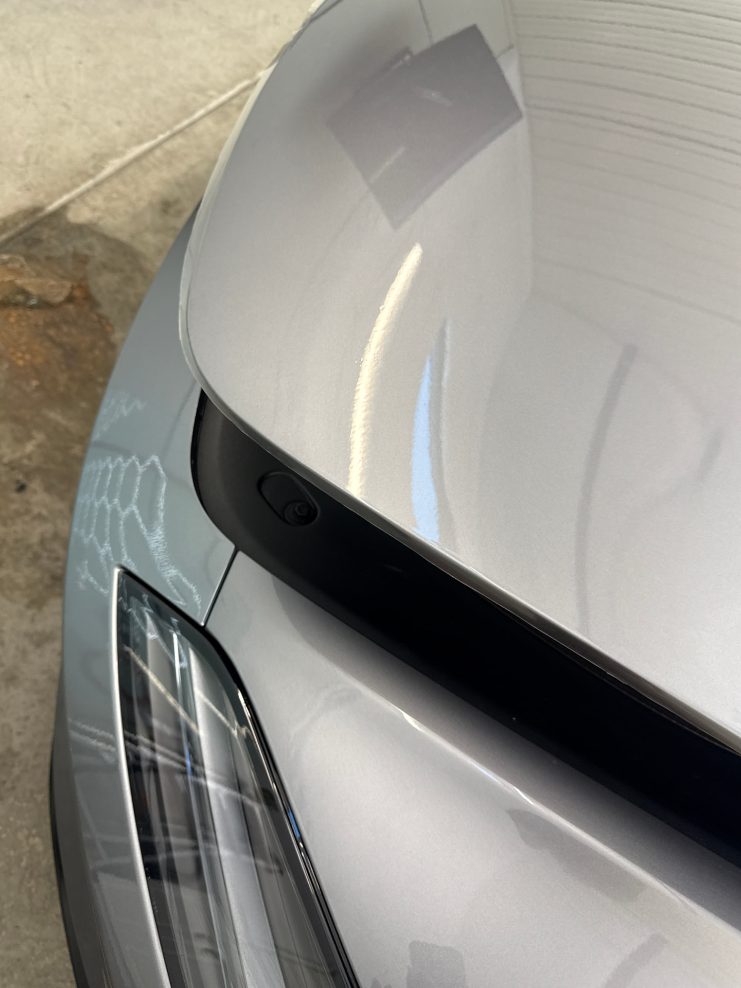 Finished full front end paint protection film on the hood of a 2026 Tesla Model 3