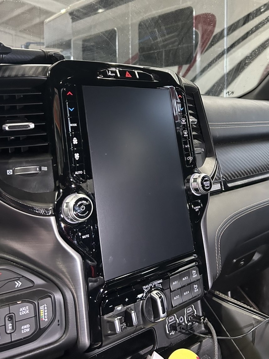 Close-up of a truck's large vertical touchscreen inside the Hypershade shop
