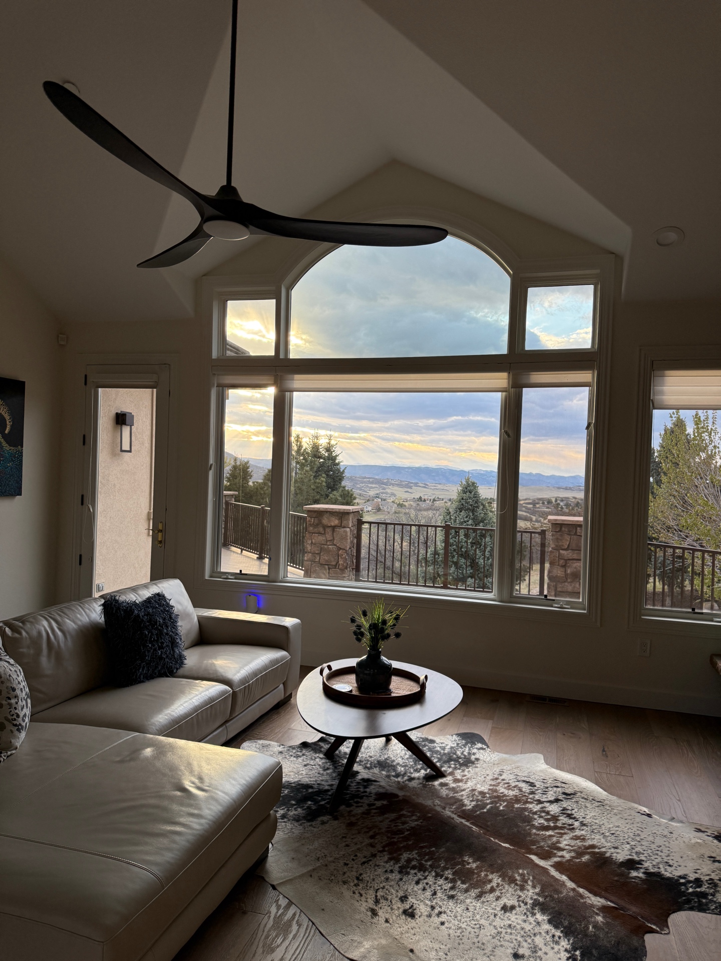 Completed arched window installation — beautiful finished result with mountain views